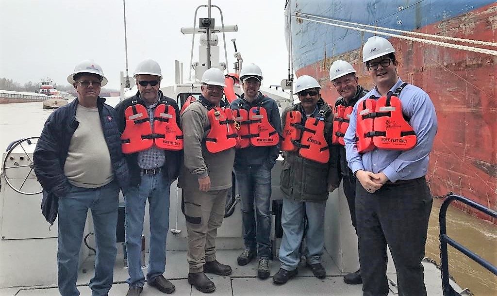 Seven People Standing on Boat