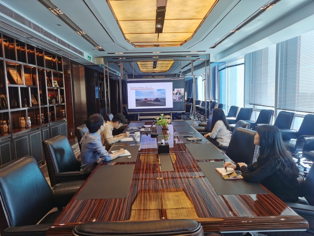 image of four people sitting at a conference table