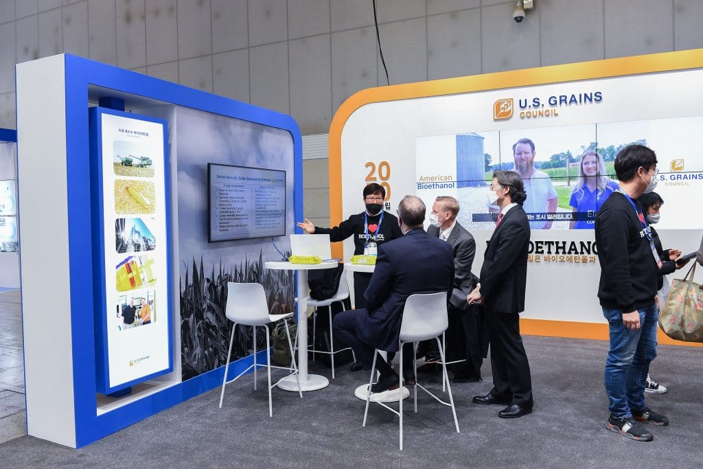 The U.S. Grains & BioProducts Council's (USGBC's) South Korea office recently took part in the Seoul Mobility Show. At the event, the Council worked to display the benefits of ethanol through conversations with attendees, interviews with the media and handing out promotional items. Pictured, USGBC director in South Korea Haksoo Kim speaks with show-goers on the Council's ethanol work.