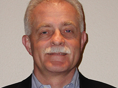 Headshot of Gerry Salzman Smiling